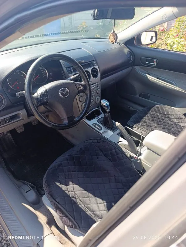 Мазда 6 в цвете шторм-грей 1.8/мкпп/120л. с.машина в хорошем состоянии в 2021году пригнана из европы, сейчас 180 регион. комплектация с кондером, круиз-меню,4стеклоподъемника, рег. руля по высоте и по вылету и т п. , номера кузова читаются, дно и пороги в хорошем состоянии, по мотору нет ни одного потёка, коробка в отличном состоянии, ходовая часть поменялна(стойки, рычаги, наконечники и т п)гур не гудит. есть ошибка по лямде и абс, хотя тормоза поменяны и датчики подключены. ступичные подшипники заменены. ц/замок, сигнализация, остальное по тел: +79494511307 +79493787559 машина в донецке, ориентир донбасс арена. цена :427 тыс. рублей продажа-обмен(предлагайте с вашей доплатой)переоформление по желанию, машина на учёте, штрафов, запретов и ограничений нет, птс, стс, дкп - фотография - 8