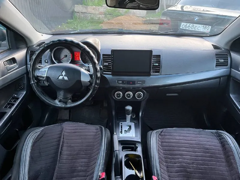 Продам mitsubishi lancer x 1.8 2008 год. 1 владелец с салона ! машина в родном окрасе ( из окраса : косметический окрас левого крыла, правое новое ) с документами полный порядок ! ( кредитов, штрафов, залогов нет ) обслуживалась только у официального дилера ! по машине очень много вложено и сделано - неделю назад поставил новый двигатель ( в отличном состоянии 80т пробега ), новый масляный насос, сразу поставил новый комплект грм ( цепи, натяжители и так далее ) машина всегда обслуживалась качественно и вовремя. автозапуск с ключа. стоит хорошая музыка с блютузом. коробка работают идеально без нареканий ! осмотр донецк. цена : 800 000. торг ! +79494914212 - фотография - 7