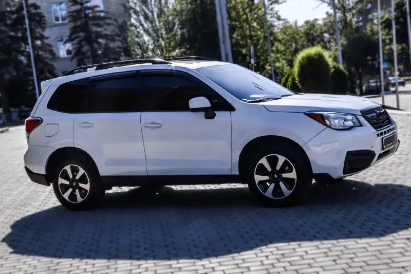 ‼️продам ‼️ subaru forester sj 2018г. в. 2.5л. бензин 171 л. с. 4wd пробег: 180 000км постоянный полный привод. адаптивный круиз контроль, удержание в полосе, датчик слепых зон, камера заднего вида. панорамный люк. автомобиль просторный, проходимый, вместительный. хорош в городской динамике, приятен по трассе, достоен по бездорожью. г. донецк учет днр. я хозяин. цена: 1.900.000₽ +79494041516 - фотография - 2