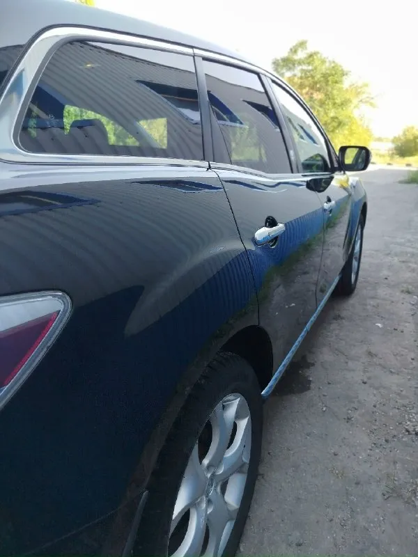 Продам машину в хорошем состоянии. mazda cx7 2008 год 2.3 turbo мотор в отличном состоянии полностью обслужен новые цепи фазорегулятор башмаки натяжители сальники коленвала все запчасти по мотору которые ставил оригинал, все расходники менялись вовремя по мотору не единой капли масла акпп работает исправно раздатка работает исправно авто полный привод по электрике все работает как положено фары отполированы и защищены в броне плёнке капот тоже поклеен пленкой кованый карбон смотрится очень круто по ходовой части все отлично колеса r19 зимние шины одам в подарок авто лично мое не перекуп более подробно за информацией звонить по номеру 👇 +79493795882 дмитрий цена 💸 за машину 1.1 🍋 хорошим людям торг. 📞 звоните: +7(949)3795882 - фотография - 7