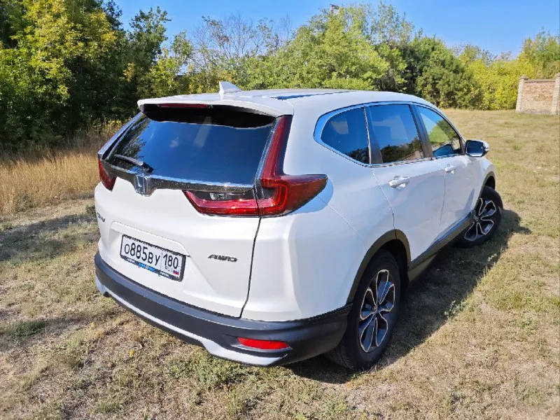 Продам автомобиль honda cr-v 2021 г. в. пробег 76000 объём двигателя 1.5, 190л. с. коробка вариатор, постоянный полный привод, адаптивный круиз контроль, датчики слепых зон, предотвращение выезда с полосы, электронная панель приборов, подогрев передних сидений, безключевой доступ, система start/stop, камера заднего вида, двух-зонный климат контроль, мультируль, полный набор систем активной безопасности, мультимедиа панель, поддержка apple carplay и android auto. прекрасный семейный автомобиль с большим и комфортным салоном. vin - в карусели фото. штрафов / запретов нет цена :2.550.000 осмотр г. енакиево торг у капота +79495002238 - фотография - 5