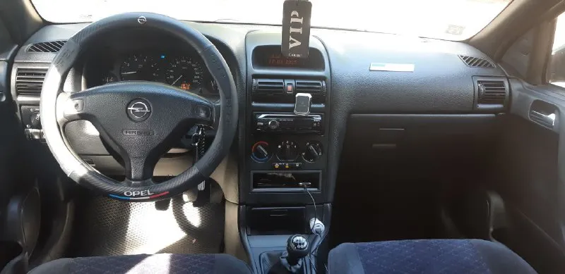 Продаётся opel astra g 2001 год 1.4. 90. лошадей мотор работает как часы тихо не дымит не троит масло не расходует коробка отлично ходовая часть мячик автомобиль в отличном состоянии за машину не стыдно кондиционер работает холодит очень хорошо подогрев зеркал подогрев заднего стекла вся электрика всё что должно работать всё работает как говорится сел и поехал. цена 385 т. р. вопросы по телефону +79495823678 - фотография - 9