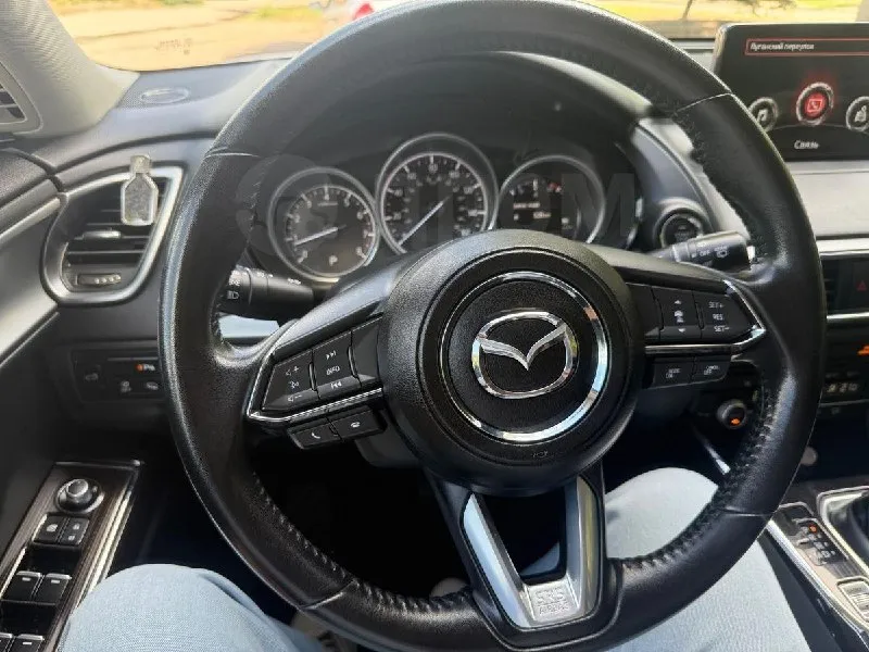 Mazda cx-9 2020 цена 3.3 млн руб. двигатель бензин, 2.5 л мощность 231 л. с., налог коробка передач привод 4wd цвет белый пробег 73 000 км поколение 2 комплектация 2.5t at exclusive отличное состояние, масло менял каждые 7000км, расходники менялись по регламенту, любые проверки на сто, юридически чистый. автомобиль с америки пригонял для себя с пробегом в 17000км в 2022 году лнр. учет рф, 1 собственик с 2022 года. в 2025г поставил на учет рф, никаких доп платежей(утиль сбор и т. д.) не нужно делать. оформление в мрэо без проблем. два ключа, сигнализация starlaine gps 2 сим-карты. комплект зимней резины, второй комплект ковриков в подарок. срочно!реальному покупателю торг! +7 959 133-93-93 денис (луганск) 📞 звоните: +7(959)1339393 - фотография - 9