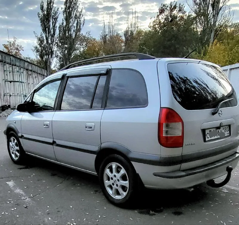 Opel зафира opel zafira 1.6 16v рестайлинг 2004 г. в. превосходное состояние авто. пригнана в 2018 году в донецк, один собственник. родной пробег, вся история обслуживания. установлено пропан. не бит, корозии нет. стекла атермальные родные. хорошая комплектация: 10 airbag, климат контроль, круиз контроль, птф, полный бортовой компьютер итд. все работает. 2 ключа. донецк. плохая связь. 620т. р. +79498049797 📞 звоните: +7(949)8049797 - фотография - 3