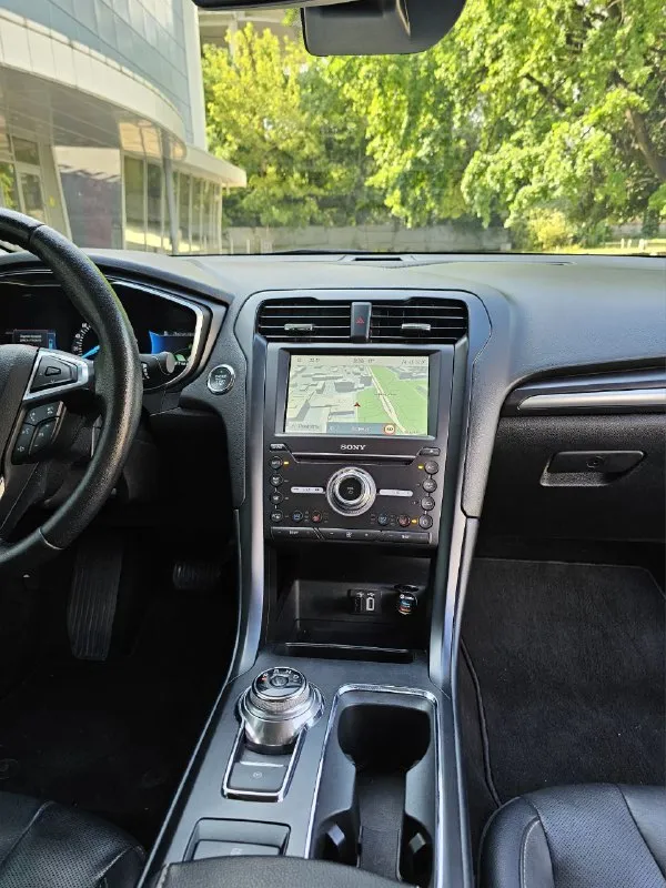 Ford fusion hybrid 2019, топовая комплектация titanium. пробег 99 800 км. я единственный владелец в рф. история чистая, птс оригинал, без подводных камней! 🔥 гибрид! реальный расход 5-6 л/100 км, полного бака хватает на 900 км. тихий, комфортный, управляется отлично. ✅ адаптивный круиз, автоторможение, удержание в полосе, слепые зоны ✅ камера заднего вида, парктроники, биled фары ✅ кожаный салон, сиденья с памятью, подогревом и вентиляцией ✅ подогрев руля, 2-зонный климат ✅ аудио sony (12 динамиков), навигация ✅ автозапуск, шайба-джойстик кпп ✅ бесключевой доступ, в т. ч. кодовый ✅❗ европейские зеркала — с широким обзором и складыванием 📌 пробег оригинальный, не скручен! 📌 любая проверка/сто 🚗 продаю без спешки, авто радует. только прямому покупателю, без посредников. 💬 1 890 000 ₽. +79494710689 - фотография - 7