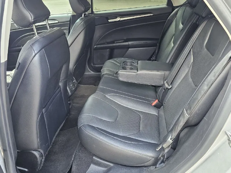 Ford fusion hybrid 2019, топовая комплектация titanium. пробег 99 800 км. я единственный владелец в рф. история чистая, птс оригинал, без подводных камней! 🔥 гибрид! реальный расход 5-6 л/100 км, полного бака хватает на 900 км. тихий, комфортный, управляется отлично. ✅ адаптивный круиз, автоторможение, удержание в полосе, слепые зоны ✅ камера заднего вида, парктроники, биled фары ✅ кожаный салон, сиденья с памятью, подогревом и вентиляцией ✅ подогрев руля, 2-зонный климат ✅ аудио sony (12 динамиков), навигация ✅ автозапуск, шайба-джойстик кпп ✅ бесключевой доступ, в т. ч. кодовый ✅❗ европейские зеркала — с широким обзором и складыванием 📌 пробег оригинальный, не скручен! 📌 любая проверка/сто 🚗 продаю без спешки, авто радует. только прямому покупателю, без посредников. 💬 1 890 000 ₽. +79494710689 - фотография - 9