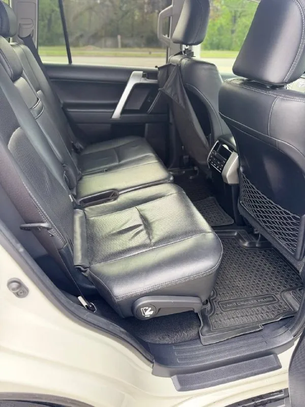 Продам toyota land cruiser prado 150, 2019 года, рестайлинг, мотор 2.8 самый надёжный и экономный, расход 10 литров по городу по трассе 8. машина европейская в самой максимальной комплектации, кожаный салон, электро сидения, led фары, максимальные блокировки мостов, музыка jbl, камеры 360, без пневмоподвески, мертвые зоны в зеркалах, заводится с кнопки, безключевой доступ, климат контроль 3-х зонный, круиз контроль, парктроники, навигация, подогрев и вентиляция всех сидений большой монитор и многое другое, покупалась в россии у официального дилера toyota, гаражное хранение. в идеальном состоянии полностью обслужена. пробег 118 тысяч. цена 4.500.000. возможна продажа в кредит. осмотр донецк +79494498253 александр. +79494956671 +79852081609 📞 звоните: +7(949)4498253 - фотография - 9