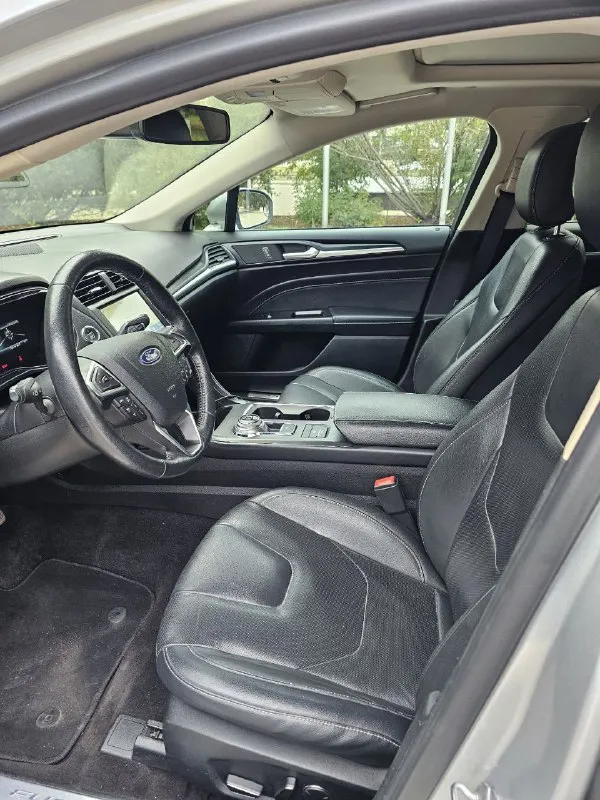 Ford fusion hybrid 2019 titanium (usa) американский mondeo в топовой комплектации! пробег 99 800 км 🔋 гибрид — расход 5–6 л/100 км, на баке до 900 км пробега. 🔧 полностью обслужен, без сюрпризов. 💪надёжный — такие фьюжены в сша проходят 500 000+ км без проблем. ❗первый владелец в рф, подбирал и пригонял под себя. 💎 titanium: адаптивный круиз, удержание в полосе, автоторможение, контроль слепых зон, full led фары, камера, парктроники, кожа, вентиляция и подогрев сидений, подогрев руля, аудио sony, бесключевой доступ, дистанционный запуск, кодовый вход, настраиваемая подсветка, еврозеркала (!) с широким обзором и складыванием. 📌 пробег оригинальный, любая проверка. 💬 без посредников. 📍 осмотр и тест-драйв в донецке 💸 1 890 000 ₽ +79494710689 - фотография - 10