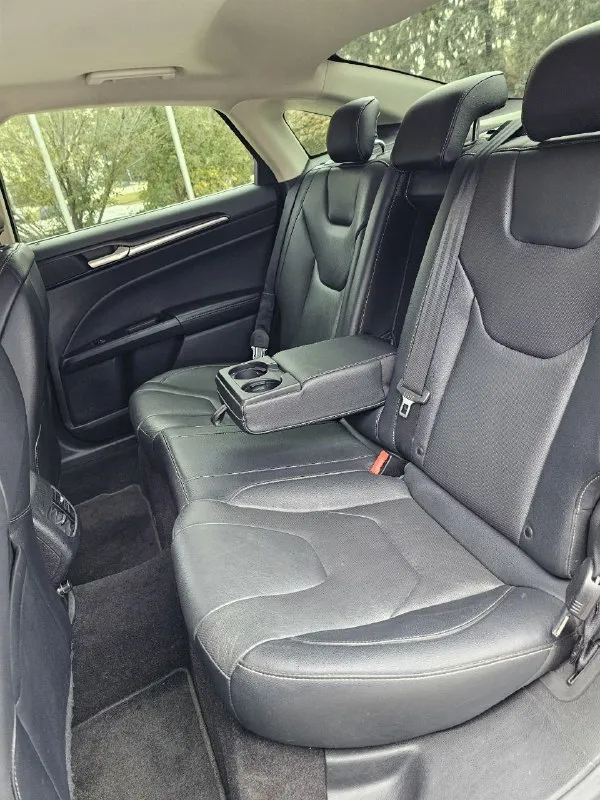 Ford fusion hybrid 2019 titanium (usa) американский mondeo в топовой комплектации! пробег 99 800 км 🔋 гибрид — расход 5–6 л/100 км, на баке до 900 км пробега. 🔧 полностью обслужен, без сюрпризов. 💪надёжный — такие фьюжены в сша проходят 500 000+ км без проблем. ❗первый владелец в рф, подбирал и пригонял под себя. 💎 titanium: адаптивный круиз, удержание в полосе, автоторможение, контроль слепых зон, full led фары, камера, парктроники, кожа, вентиляция и подогрев сидений, подогрев руля, аудио sony, бесключевой доступ, дистанционный запуск, кодовый вход, настраиваемая подсветка, еврозеркала (!) с широким обзором и складыванием. 📌 пробег оригинальный, любая проверка. 💬 без посредников. 📍 осмотр и тест-драйв в донецке 💸 1 890 000 ₽ +79494710689 - фотография - 9