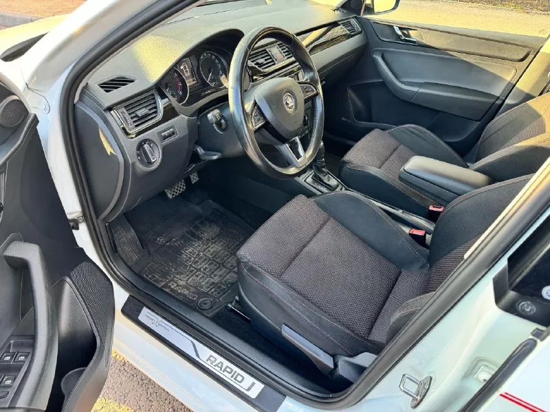 Продам skoda rapid( skoda рапид) в заводском окрасе,1хозяин, 2015 года, 1,6 двигатель, редкая комплектация hockey edition. надежный атмосферный мотор, родной пробег 174 тыс км. коробка передач-aisin, переключает плавно, без рывков. южный ухоженный автомобиль, обслуживался на клубном сервисе в ростове. по комплектации: кондиционер, монитор, стеклоподъемники, подогрев передних сидений, 2 ключа, 2 комплекта резины на дисках. территориально алчевск. цена 1 190 000 р. тел: +79591376624 📞 звоните: +7(959)1376624 - фотография - 7