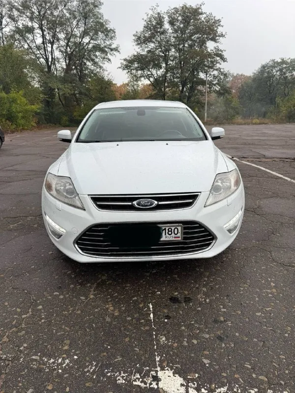 Продам ford mondeo 2012 год, объем двигателя 2,0, коробка механика комплектация люкс, кожаный салон,... - фотография