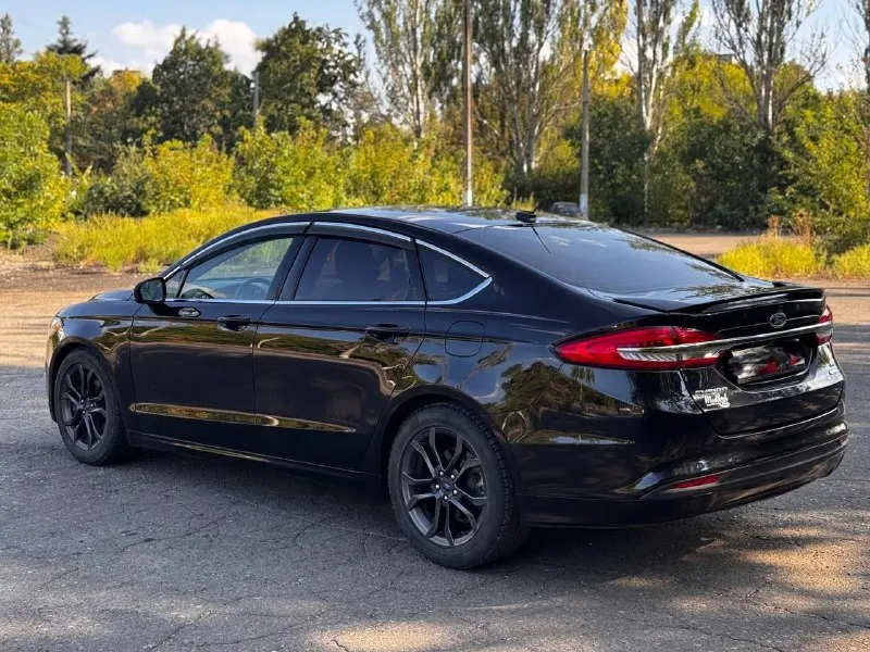 Продам ford fusion (north america) 2018 г. в., двигатель 1.5 ecoboost (181 л. с.). низкий пробег оригинальный - 31000. 6-ти ступенчатая коробка автомат (aisin). авто старт/стоп на светофорах, мультируль, кожаный салон, регулировка водительского сиденья в 10 направлениях, круиз контроль, климат контроль, качественная музыка, камера заднего вида, парктроники цена 1550000 руб. торг. возможен обмен !! все вопросы по телефону +79494126265 - фотография - 4