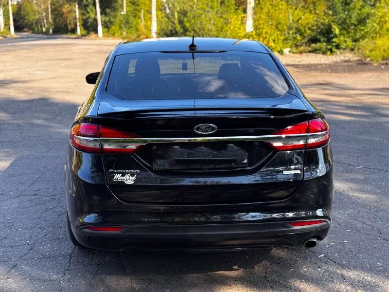 Продам ford fusion (north america) 2018 г. в., двигатель 1.5 ecoboost (181 л. с.). низкий пробег оригинальный - 31000. 6-ти ступенчатая коробка автомат (aisin). авто старт/стоп на светофорах, мультируль, кожаный салон, регулировка водительского сиденья в 10 направлениях, круиз контроль, климат контроль, качественная музыка, камера заднего вида, парктроники цена 1550000 руб. торг. возможен обмен !! все вопросы по телефону +79494126265 - фотография - 6