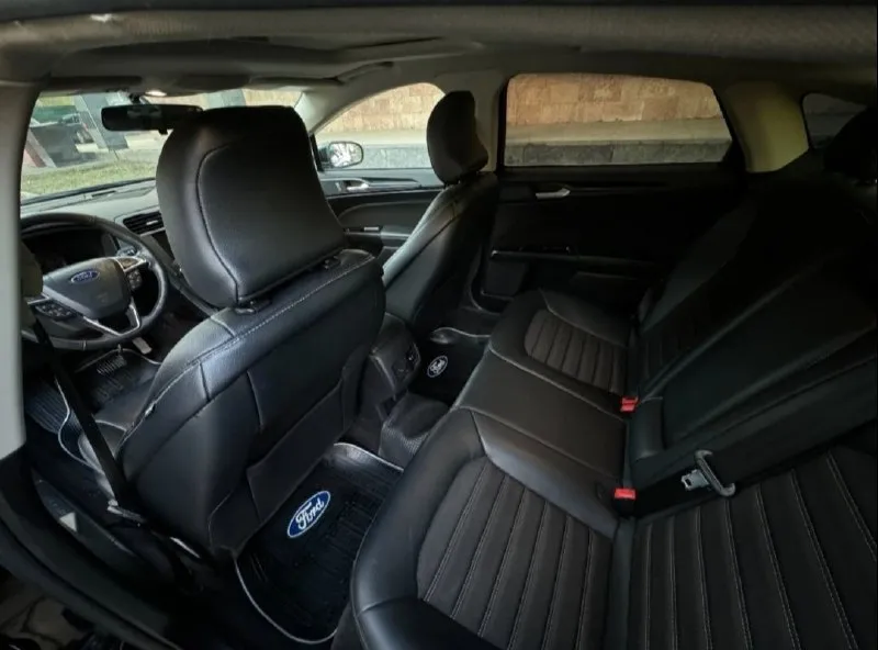 Продам ford fusion (north america) 2018 г. в., двигатель 1.5 ecoboost (181 л. с.). низкий пробег оригинальный - 31000. 6-ти ступенчатая коробка автомат (aisin). авто старт/стоп на светофорах, мультируль, кожаный салон, регулировка водительского сиденья в 10 направлениях, круиз контроль, климат контроль, качественная музыка, камера заднего вида, парктроники цена 1550000 руб. торг. возможен обмен !! все вопросы по телефону +79494126265 - фотография - 8