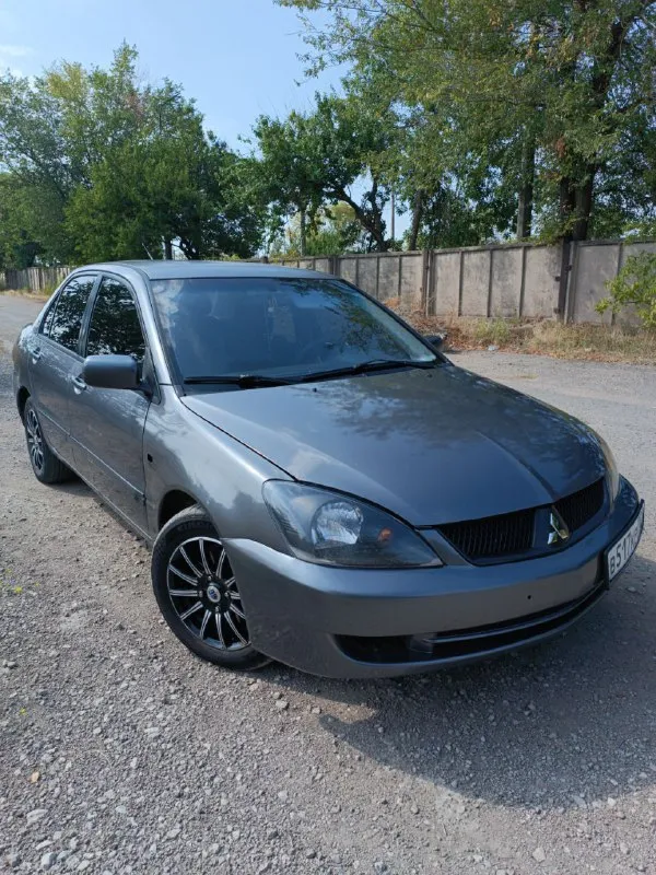 Mitsubishi lancer 9 1.6 автомат подымливает по кузову есть нюансы примята водительская дверь. коробк... - фотография