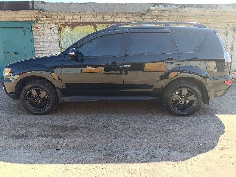 Продажа в днр продам личный автомобиль mitsubishi outlander xl год выпуска 2011 передний привод объе... - фотография