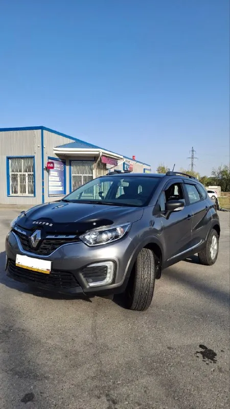 Продаётся renault kaptur 1.6 cvt 2021 — надёжный и комфортный кроссовер! пробег 41 500 км, один владелец, эптс, всё обслуживание у официального дилера. комплектация style с мультимедиа, сенсорным экраном, подогревом сидений и климат-контролем. двигатель 1.6 л, 114 л. с., вариатор x-tronic — плавная езда в городе и на трассе. машина в заводской окраске без повреждений, свежая замена масла на 33 600 км. в подарок зимние колеса на дисках и рейлинги. автомобиль в отличном состоянии, вложений не требует — сел и поехал. обмен не интересует, перекупам просьба не беспокоить. идеальный вариант для тех, кто ищет ухоженный, экономичный и практичный кроссовер. просмотр в ростове-на-дону. +79197106474 - фотография - 10