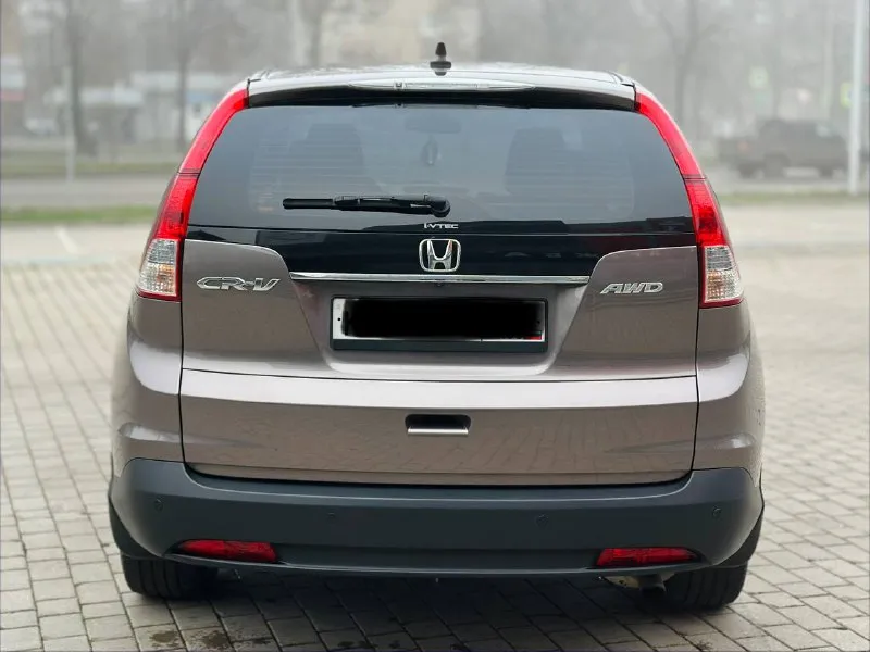 Honda cr-v 2.4 автомат бензин 2015г автомобиль в хорошем состоянии не каких вложений не требует! автомобиль в родном окрасе!!! 1 собственник из самого автосалона!!!! подогрев сидений, круиз-контроль, климат-контроль, мульти-руль, 4wd полный привод, камера заднего вида, парктроник, два комплекта резины, два ключа, с документами полный порядок!!!!! переоформление в мрэо! цена 1.745₽ все вопросы по тел:+79494681080 - фотография - 5
