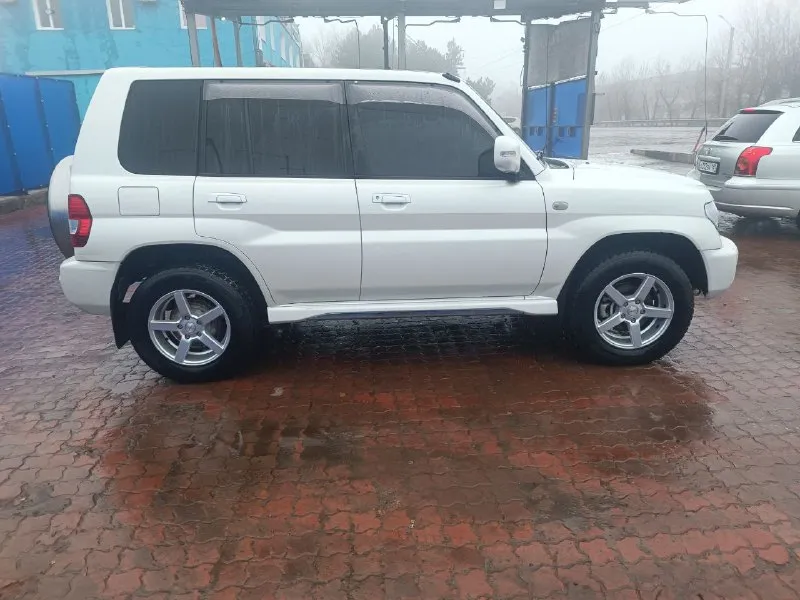 Mitsubishi pajero io 2.0 2005 г. в. пробег 150 тыс. полноценный полный привод с отключаемым передним мостом и блокировкой дифференциала. первый и единственный собственник в рф гур, климат, электрозеркала, 2din android магнитола, led в два этажа, кузов и салон в превосходном состоянии. цена 1🍋 возможен обмен на легковой авто с +79590135288 📞 звоните: +7(959)0135288 - фотография - 4