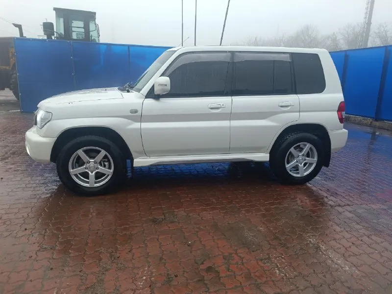 Mitsubishi pajero io 2.0 2005 г. в. пробег 150 тыс. полноценный полный привод с отключаемым передним мостом и блокировкой дифференциала. первый и единственный собственник в рф гур, климат, электрозеркала, 2din android магнитола, led в два этажа, кузов и салон в превосходном состоянии. цена 1🍋 возможен обмен на легковой авто с +79590135288 📞 звоните: +7(959)0135288 - фотография - 7