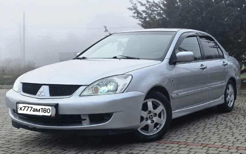 Mitsubishi lancer 9 рестайлинг самой полной комплектации. год выпуска: 2007. техническое состояние на 5+ мотор 1,6 подвеска отрабатывает мягко и комфортно. 🏀 кпп-5ст механика без нареканий. кузов в хорошем состоянии. в дтп не участвовал. в родном металле без ржавчины и гнили. остекление заводское. днище и стаканы лонжеронов в хорошем состоянии. в машине имеется кондиционер (рабочий). airbag srs abs подушки безопасности электроподъемники всех стекол 4 доводчика стекол. гур подогрев сидений. подогрев зеркал. подогрев заднего стекла. электропривод зеркал. серво-руль. цент-замок. хорошая музыка. процессорная магнитола с яндекс навигатором. ютубом и много других функций. задние колонки avatar. передние dl audio barracuda. салон чистый и опрятный в дорогих чехлах из эко-кожи. оригинальные evo-коврики для lancer установлены. дорогие led-лампы osram ledriving hl spring в головном свете. птф-линзы в авто работают все, каждая кнопочка. донецк. +79494491943 +79495609473 цена - 510.000 с хорошим торгом. - фотография - 3