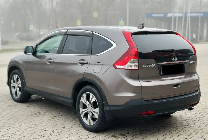 Honda cr-v 2.4 автомат бензин 2015г автомобиль в хорошем состоянии не каких вложений не требует! автомобиль в родном окрасе!!! 1 собственник из самого автосалона!!!! подогрев сидений, круиз-контроль, климат-контроль, мульти-руль, 4wd полный привод, камера заднего вида, парктроник, два комплекта резины, два ключа, с документами полный порядок!!!!! переоформление в мрэо! цена 1.670 цена только сегодня !!!! все вопросы по тел:+79494681080 📲 tg: дмитрий 📞 звоните: +7(949)4681080 - фотография - 4