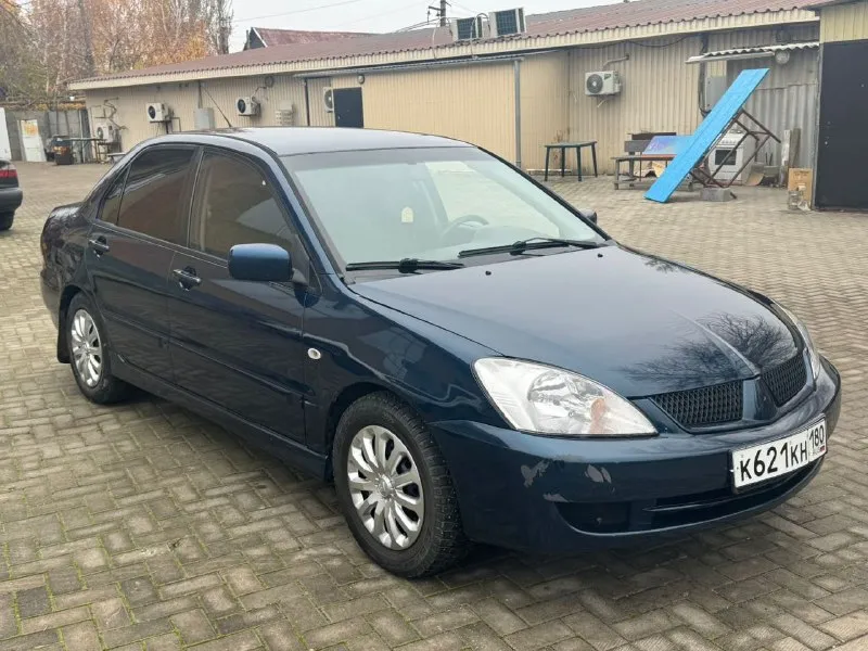 Mitsubishi лансер 9 2004 года двигатель 1.6 коропка ат не димит масло не расходует карапка работает... - фотография