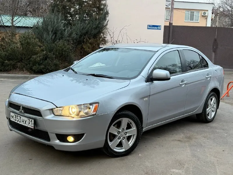 Продам mitsubishi lancer x 1.8 автомат авто в изумительном состоянии родной пробег 159 тысяч! один хозяин за всё время!! год 2009 без дтп в родном окрасе кузов без сколов и тд машина хранилась в теплом и сухом гараже! двигатель коробка ходовая в отличном состоянии максимальная комплектация под рулевые лепестки два комплекта колёс зима/лето сигнализация с автозапуском два ключа и многое другое цена 760 тыс рублей!! из за срочности +79495323651 +79496208155 - фотография - 2