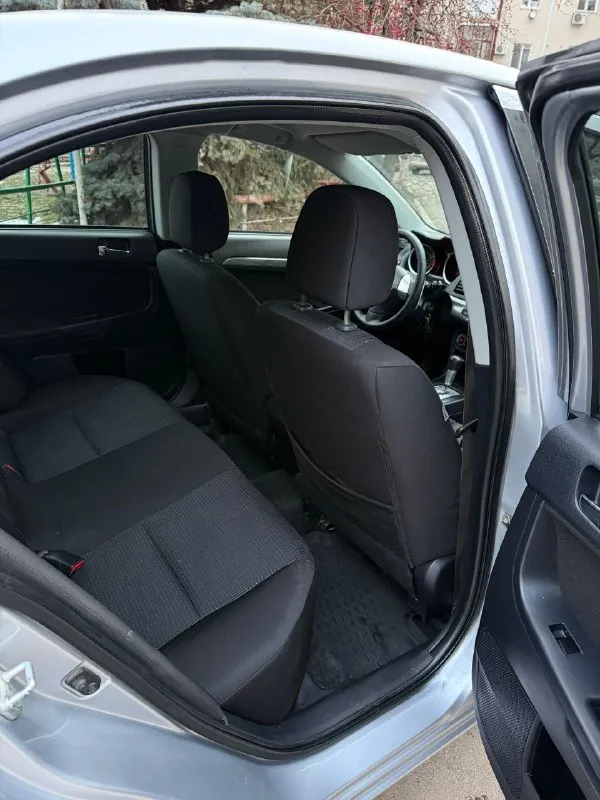 Продам mitsubishi lancer x 1.8 автомат авто в изумительном состоянии родной пробег 159 тысяч! один хозяин за всё время!! год 2009 без дтп в родном окрасе кузов без сколов и тд машина хранилась в теплом и сухом гараже! двигатель коробка ходовая в отличном состоянии максимальная комплектация под рулевые лепестки два комплекта колёс зима/лето сигнализация с автозапуском два ключа и многое другое цена 760 тыс рублей!! из за срочности +79495323651 +79496208155 - фотография - 9
