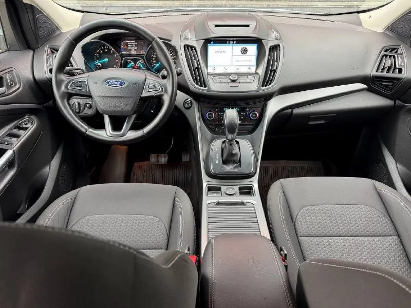 Ford kuga, 2018 1.5 ат, 4wd, 128000 км. официальный дилерский автомобиль. два владельца. хорошая комплектация trend plus: -раздельный климат-контроль - мультимедийная система sync 3 с голосовым управлением на русском и carplay - система помощи при трогании на подъеме - подрулевые лепестки переключения передач - парктроник - бесключевой доступ и запуск двигателя -сигнализация с авто запуском - электронный стояночный тормоз - кожаное мультифункциональное рулевое колесо с обогревом - рейлинги на крыше - оригинальные легкосплавные диски r17 возможно оформление в кредит. возможен обмен. более детальная информация по телефона. цена - 1.590.000 р. +79494041233 - фотография - 7