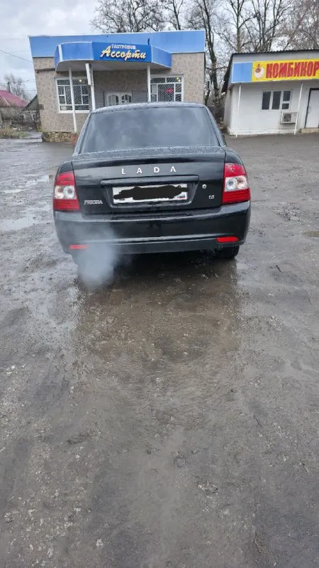 Продажа lada priora, 2016 год в донецке двигатель бензин, 1.6л мощность 106 л. с., коробка передач мкпп привод fwd тип кузова седан. цвет черный руль левый поколение 2 поколение комплектация люкс 600тыс торг номер:+79495276232феникс +79498674262 телеком - фотография - 3