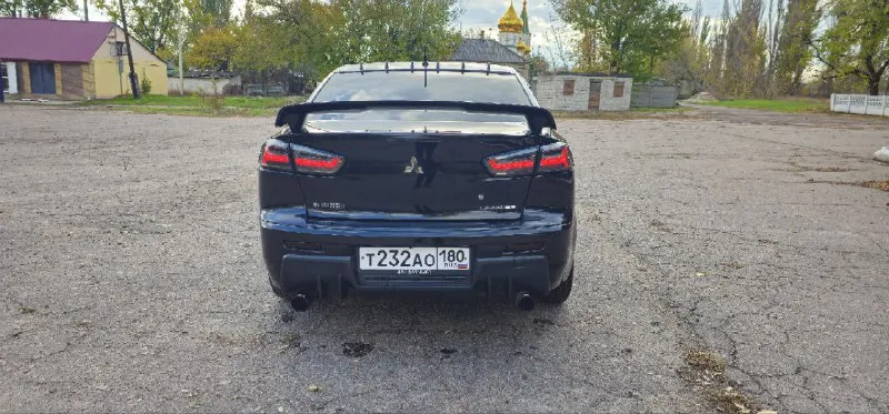 Mitsubishi lancer х 😎 пробег 159000km🛞 год выпуска 2012 объем двигателя 1,8 16 клоп 147 л. с. установлены кастомные фары зад и перед с анимацией приветствия😍(родные лежат в рабочем состоянии идут в комплекте) сигнализация старлайн с автозапуском, два ключа🔑 кондиционер заправлен работает исправно👍 2-х режимный подогрев передних седений🔥 4 электро стеклоподъемника! электро регулировка зеркал с подогревом! сделан кастомный выхлоп🤤 резина зимняя новая! сделан капитальный антикор днища!!! мультирул и круиз контроль! андроид магнитола + камера заднего вида! цена 890 000 руб. торг по факту у капота! +79495106384 сергей(если нет связи на этот же номер в тг пишите) - фотография - 2