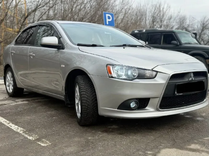 Mitsubishi lancer x 2012 год мотор 1.6 коробка автомат. родной пробег 135 тыс км. автомобиль в хорош... - фотография