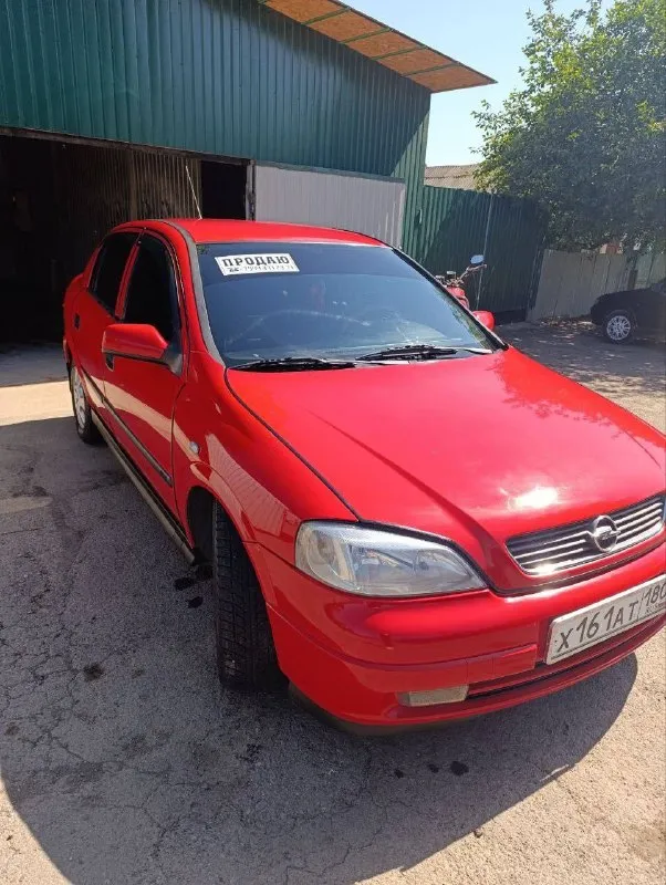 С прискорбием вынужден расстаться со своим верным спутником, автомобилем марки opel, модель astra g, год выпуска 1999. истинно преданный друг, этот автомобиль верой и правдой служил мне на протяжении 3 лет, став свидетелем множества приключений и надежным партнером в повседневной жизни. этот автомобиль — не просто средство передвижения, а воплощение мошности и элегантности. его изысканный дизайн благородный красный цвет привлекает восхищенные взгляды, а просторный кожаный салон дарит непревзойденный комфорт как водителю, так и пассажирам. под капотом скрывается мощный бензиновый 1.8, готовый покорять любые дороги. автомобиль оснащен автоматическая коробка передач, передный привод, мультимедия, стеклопакет, кондиционер. все технические аспекты находятся в идеальном состоянии, благодаря своевременному обслуживанию и бережному отношению. пробег составляет 150000км, что для данного автомобиля является лишь началом его долгой и плодотворной жизни. я являюсь единственным владе 📞 звоните: +7(949)7954277 - фотография - 2