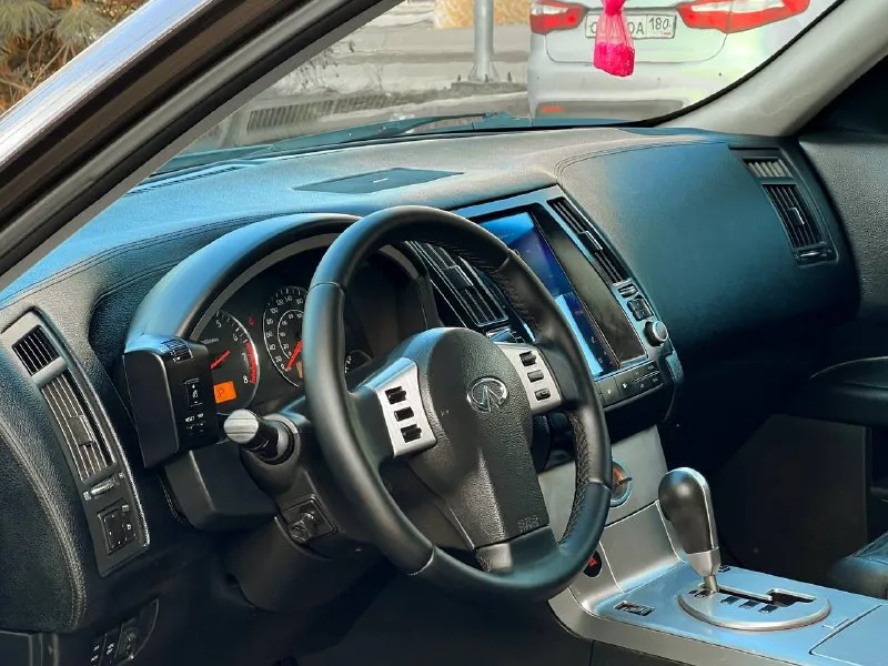 В продаже в идеальном состоянии infinity fx35, инфинити, вложений не каких не требует ! в дтп не когда не участвовал 100% обслужен абсолютно весь ! кузов без корозии и каких либо дефектов ! двигатель работает идеально! коробка автомат, работает идеально ! пробег 152 км. ! жирная комплектация, кожаный салон, эл. сиденья, память сидений, эл. регулирования руля, поставили tesla монитор google, качественный, камера заднего вида, люк, регулирование поясницы, доработанные фары сделано очень качественно, и многое другое вложено очень много сил времени и денег ! любое переформление, я хозяин, возможен обмен, на авто дешевле, цена : 925 руб. реальному покупателю реальный торг ! +79494549599 также есть телеграмм, и max 📞 звоните: +7(949)4549599 - фотография - 9