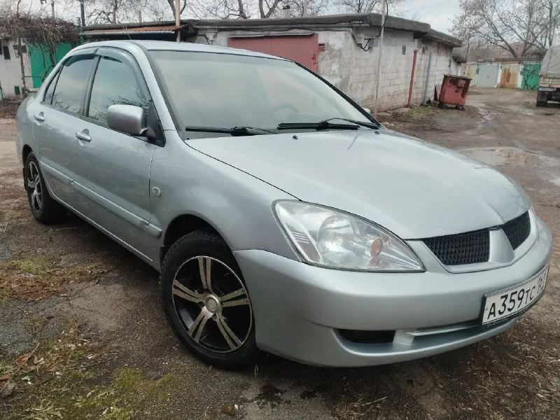Mitsubishi лансер 9 mitsubishi lancer 9 год выпуска 2005 пробег 248 тысяч км двигатель 1.6 в отличном состоянии, масло не ест не дымит. кпп четко без хрустов и вылетов ручник держит. кондиционер холодит печка греет кузов без гнили и ржавчины. резина отличная зима. литые диски переоформление без проблем карта то сделана находится в мариуполе цена 460 тысяч рублей, торг уместен. +79490250401 📲 tg: олег 📞 звоните: +7(949)0250401 - фотография - 2