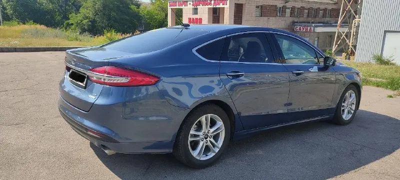 Ford fusion (north america) sе 1.5 ат есовооsт 184 л. с. 2018 года, пробег: 105тыс км комплектация sе: - кожаный салон - бесключевой доступ - stаrt/stор - автозапуск с ключа - двух зонный климат контроль - круиз-контроль - система удержания движения полос - люк - память сидений - электропривод передних сидений - подогрев сидений - подогрев руля - монитор - камера заднего вида -задние партроники - мультируль - управление аудиосистемой на руле - электроусилитель руля - датчик света - датчик дождя - дaтчик дaвлeния в шинaх - датчик наружной температуры - электропривод боковых зеркал - регулируемая рулевая колонка - телескопическая регулировка руля -вертикальная регулировка руля - цветной многофункциональный дисплей (4.2") - система электронного контроля устойчивости (еsр) -антипробуксовочная система (тсs) -система помощи при старте на подъеме (нас) цена: 1.650.000р осмотр: г. комсомольское телефон: +79493901339 александр - фотография - 3