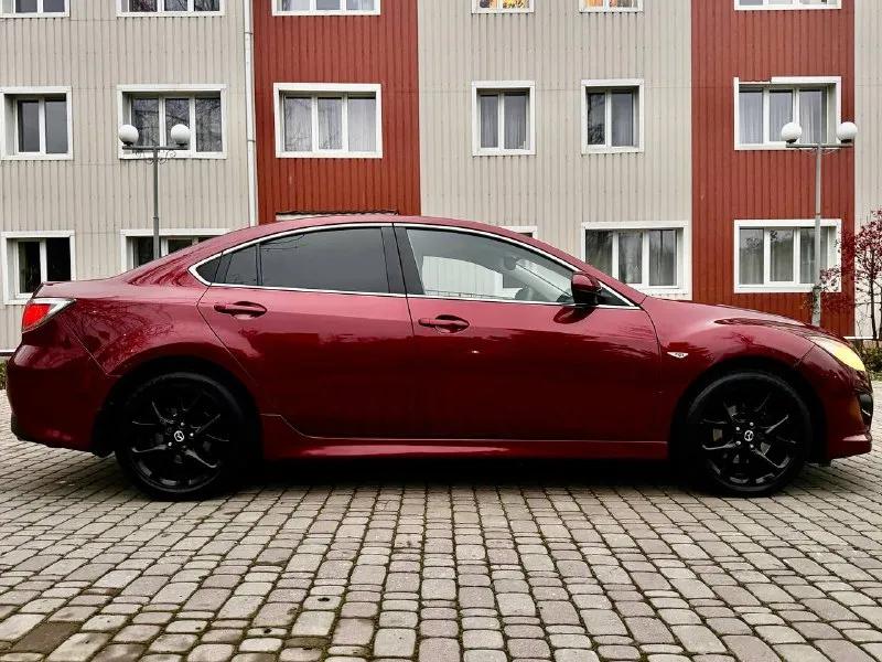 Продам свой автомобиль мазда mazda 6 2011г мотор 2.0 коробка автомат машина в отличном состоянии, кузов весь в родном окрасе. по ходовой части полный порядок, из последнего было сделано: перебрана рулевая рейка хорошим комплектующим, сделана замена масла в коробке и фильтра 40т. по комплектации: двух зонный климат контроль (работает отлично) подогрев передних сидений комбинированный салон кожа датчик дождя и света круиз контроль электрорегулировка и электроскладывание боковых зеркал два комплекта ключей пробег 175 000 км. без дтп кто ищет для себя ухоженный автомобиль звоните цена 1 000 000 руб. осмотр в донецке. + +7949 508 96 15 вячеслав - фотография - 7