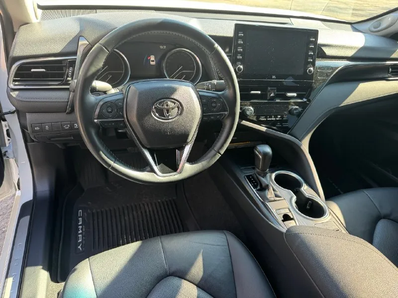 Toyota camry 75 (европа) год выпуска:2022 пробег:27.000 двигатель:2.5л(200л. с.) куплена у официального диллера. состояние нового автомобиля. капот, бампер, фары, крылья, пороги и зоны риска затянуты в дорогую бронепленку. два комплекта резины. хорошая комплектация, климат-контроль, аудио, навигация, кожа, airbags, abs, esp, светодиодные фары, центральный замок, электропривод сидений, электропривод зеркал, адаптивный круиз-контроль, датчик дождя, обогрев лобового стекла, обогрев всех сидений, парктроник, омыватель фар, удержание в полосах. автомобиль без вложений! документы в порядке, оформление в мрэо, возможна продажа в кредит. цена : 3.850.000 (торг, возможна продажа в кредит) +79493963707 (telegram) +79495834901 (telegram) 📞 🇷🇺 звоните: +79493963707 - фотография - 8