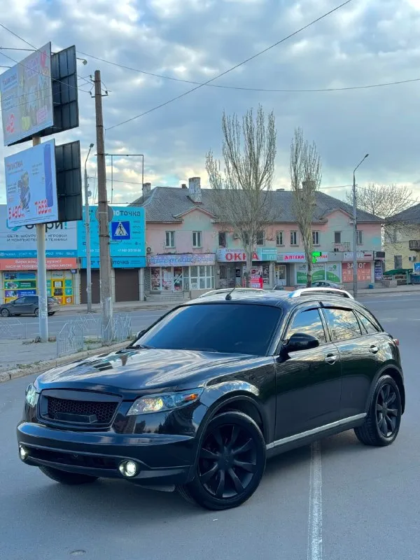 Infiniti fx35 инфинити 2007г 💰870.000💰 рестайлинг поколения (2006-2008) объем 3.5 мотор в идеальном состоянии, не дымит, не троит, весь сухой! едет очень бодро коробка автомат, работаем идеально, переключает мягко, не пинает, надежный японец ✅ ходовая не гремит, не стучит, не тянет, обслужена машинка. документы чистые ✅ без запретов, без штрафов, переоформление без проблем, сразу в мрэо, чтоб оформить на вас! исправно все работают, бензина по городу 13л осмотр г. макеевка цена 870.000 руб торг разумный у капота обмен тоже можно рассмотреть, адекватно только цените свое авто! тел. +7949-489-08-56 - +7 (949) 643-84-43 тг есть на двух номерах автотека зеленая ✅ 📞 🇷🇺 звоните: +7(908)5679496 - фотография - 1