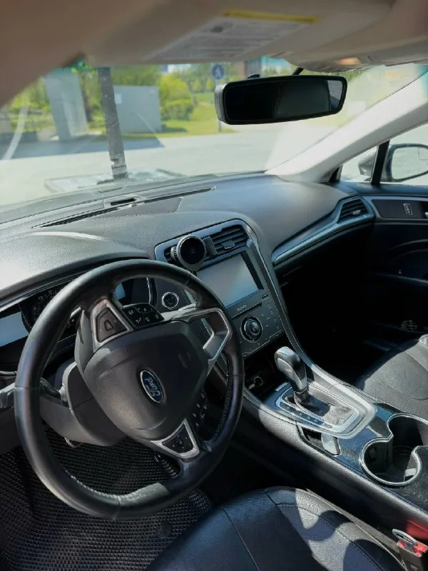 Продам ford fusion (north america). 2014г (по вин коду 2015г). машина технически в хорошем состоянии, по ходовой все отлично, ошибок никаких нет, по кузову есть нюансы, которые требуют покраски, передний бампер нужно менять. 18-е диски, масло менялось каждые 7 тыс. км, двигатель масло не ест. двигатель 2.0 ecoboost, 240 л. с. пробег родной - 249 000км собственник, 1 владелец в птс. комплектация titanium : бесключевой доступ на всех дверях удаленный автозапуск с ключа память сидений камера заднего вида подогрев сидений кнопка запуска start/stop круиз-контроль датчики давления шин атермальная пленка датчик света двухзонный климат-контроль кожаный салон цена 1 200 000р (торг) +79494230109 донецк 📞 звоните: +7(949)4230109 - фотография - 4