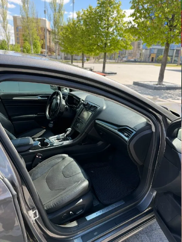 Продам ford fusion (north america). 2014г (по вин коду 2015г). машина технически в хорошем состоянии, по ходовой все отлично, ошибок никаких нет, по кузову есть нюансы, которые требуют покраски, передний бампер нужно менять. 18-е диски, масло менялось каждые 7 тыс. км, двигатель масло не ест. двигатель 2.0 ecoboost, 240 л. с. пробег родной - 249 000км собственник, 1 владелец в птс. комплектация titanium : бесключевой доступ на всех дверях удаленный автозапуск с ключа память сидений камера заднего вида подогрев сидений кнопка запуска start/stop круиз-контроль датчики давления шин атермальная пленка датчик света двухзонный климат-контроль кожаный салон цена 1 200 000р (торг) +79494230109 донецк 📞 звоните: +7(949)4230109 - фотография - 6